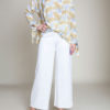 white and yellow feather printed top- front
