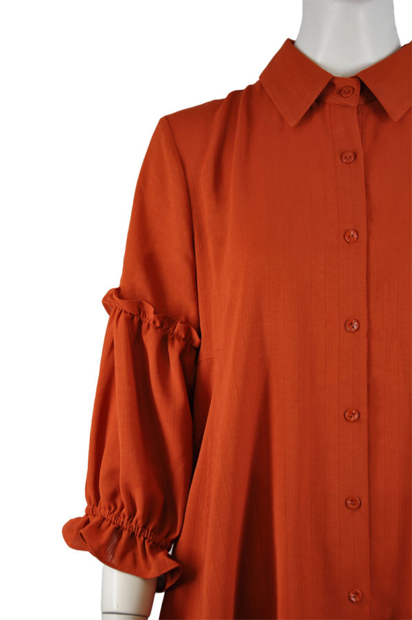 rust high low blouse with sleeve ruffle detail